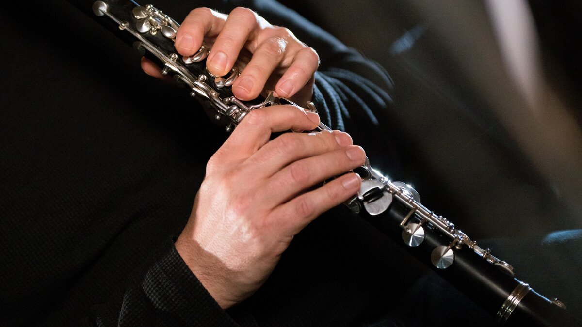 Close-up of hands on a clarinet. Photo by Robin Lambrecht.