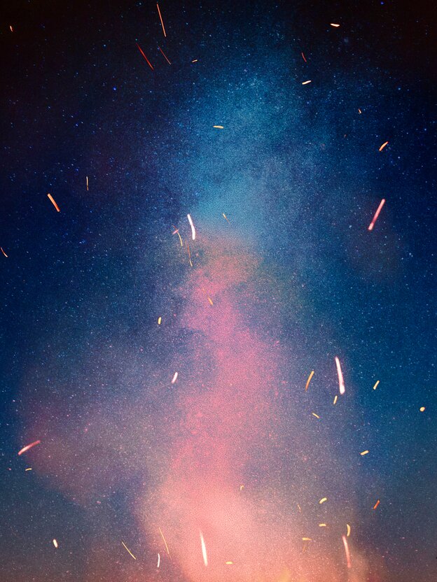 Abstracted image of sparks against a night sky