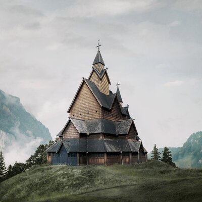 A stave church in a mountain setting