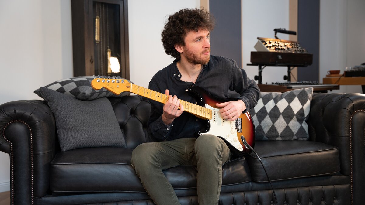 Frederik Theyssen plays an electric guitar