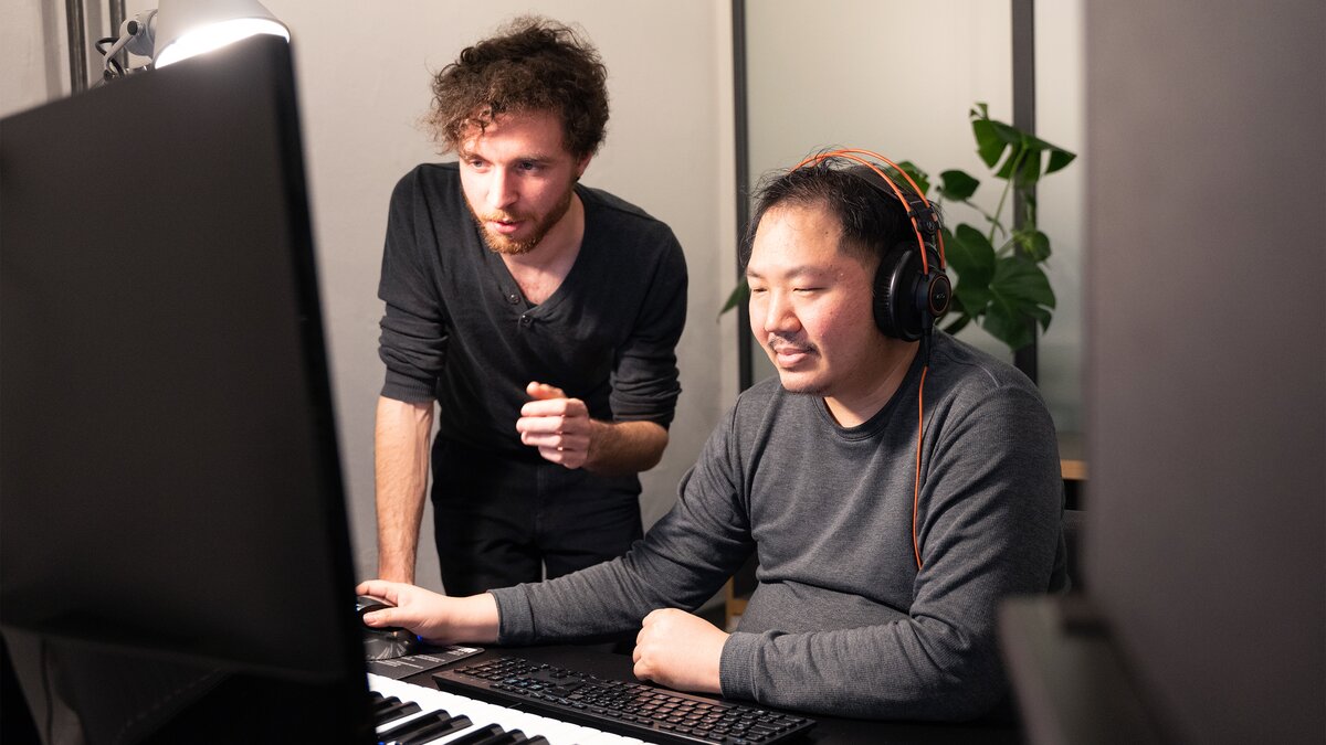Frederik Theyssen and Richard Sun work on Whisper