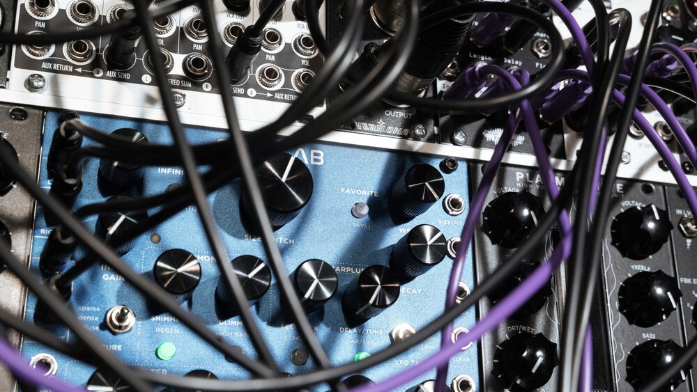 A close-up of modular effects with complicated patch cables