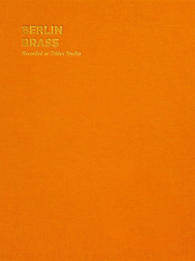 Orange canvas-like texture with the words Berlin Brass—Recorded at Teldex Studio in gold lettering