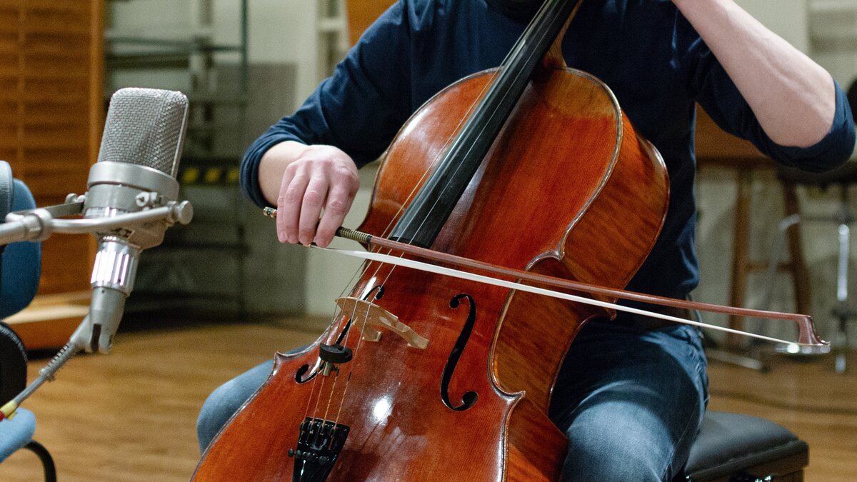 Close-up of a cello being played