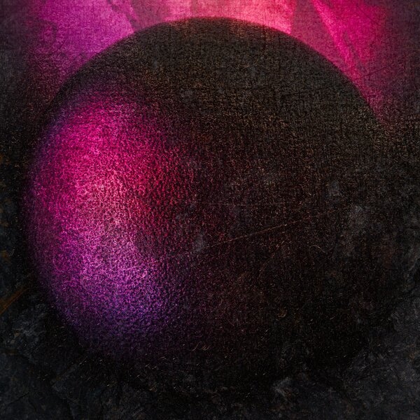 A textured maroon sphere in high-contrast light