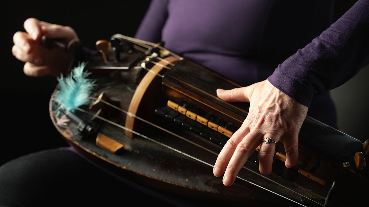 Close-up of a hurdy-gurdy being played for the Grimm sample library. Photo by Larissa Matheus.
