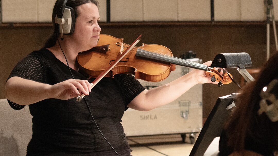 A woman recording a studio viola in LA