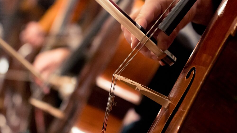 Close-up of a cello being played