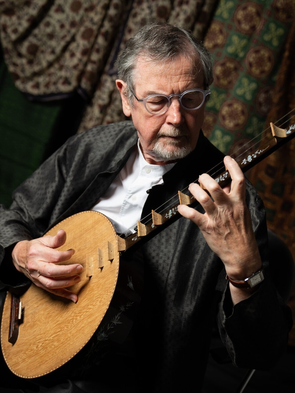 Richard Harvey plays a stringed instrument