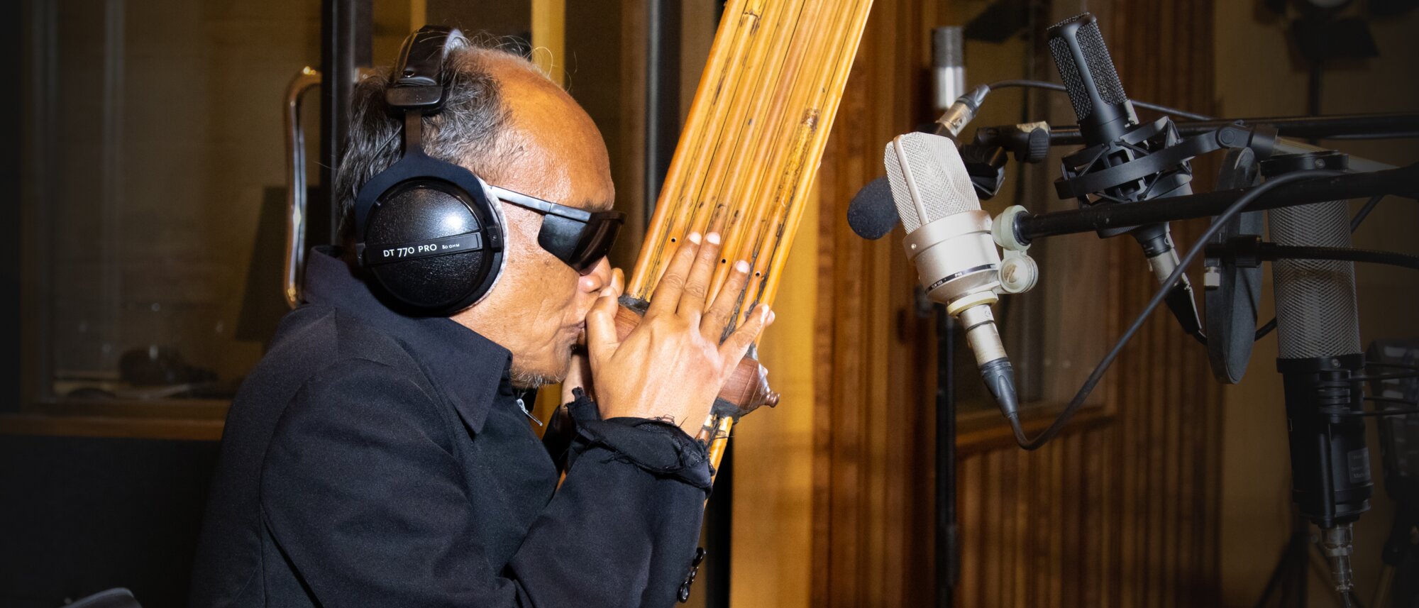 A man plays the khaen instruments